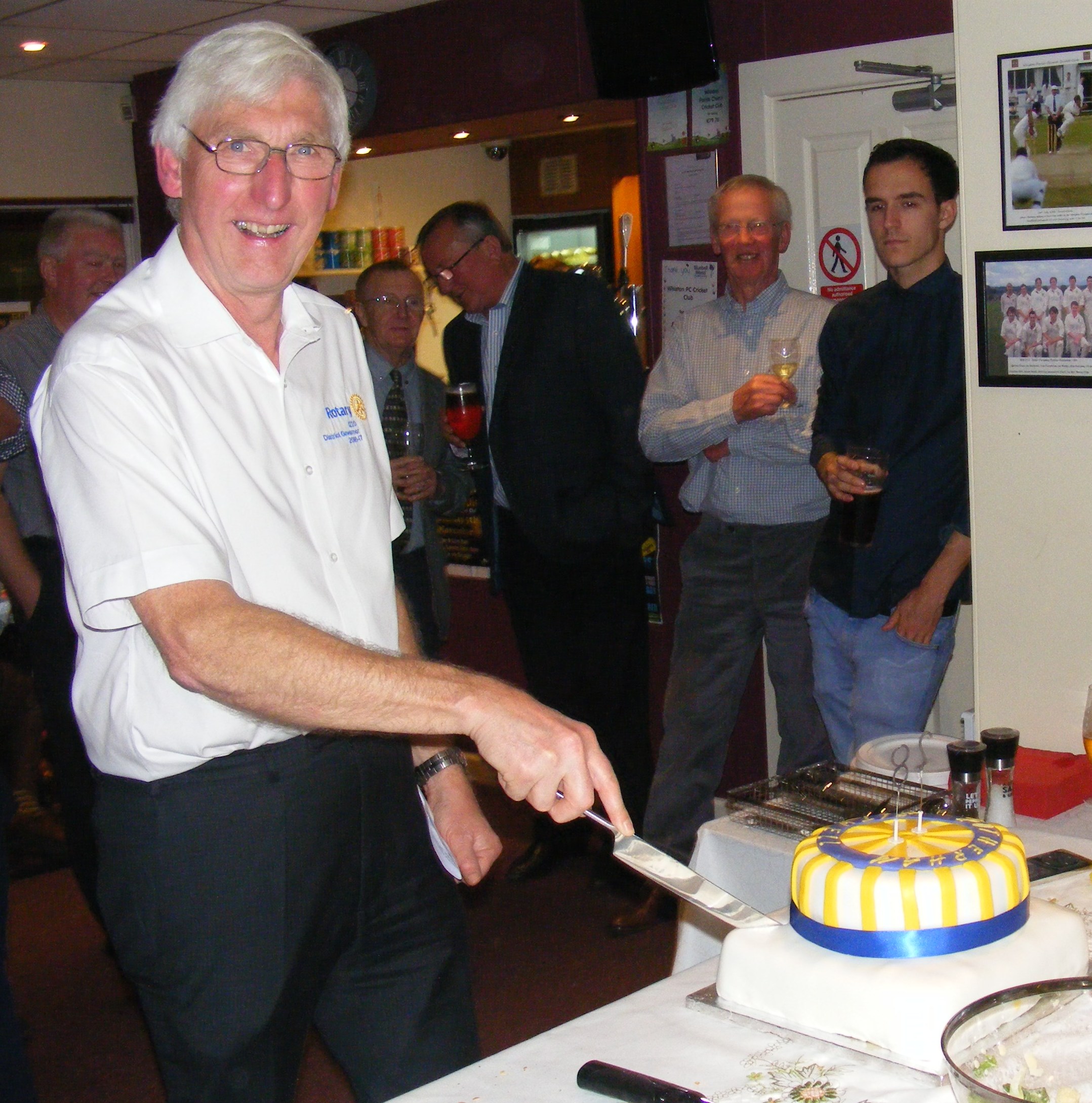 DG Colin cuts the birthday cake 