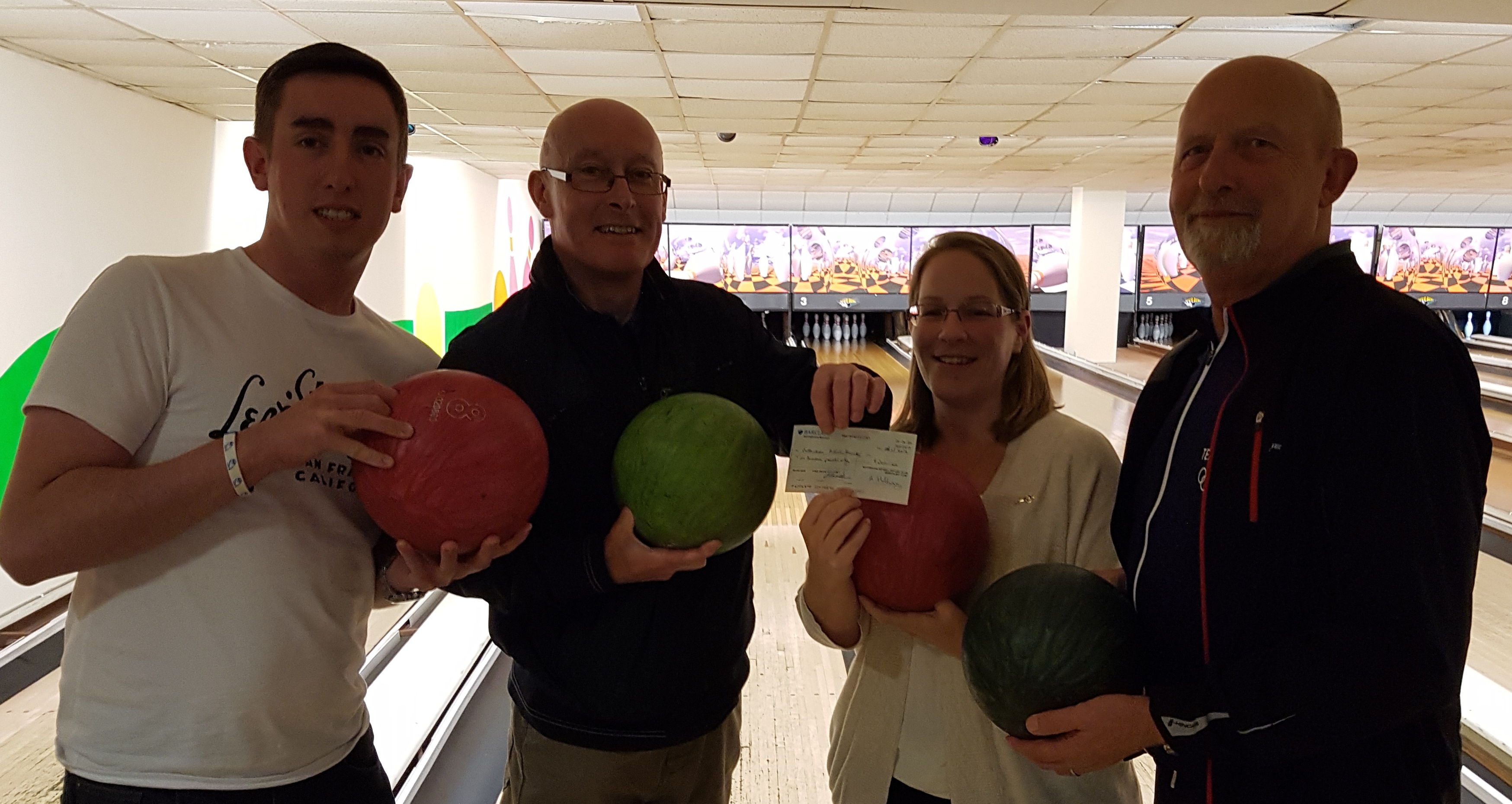 Emma presents a cheque to the members of the National Autistic Society - Rotherham Branch