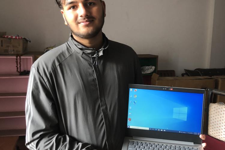 Dibas with his laptop 